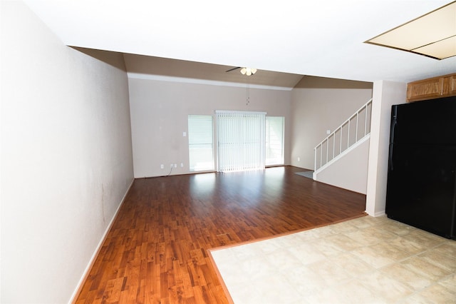 unfurnished living room with light hardwood / wood-style floors and ceiling fan