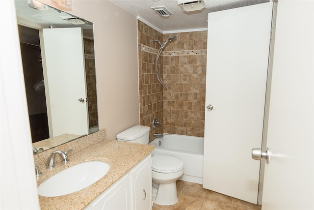 full bathroom featuring tile patterned floors, vanity, a textured ceiling, toilet, and tiled shower / bath