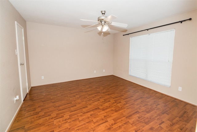 unfurnished room with hardwood / wood-style floors and ceiling fan