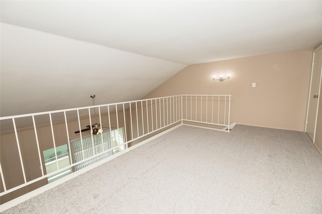 bonus room with carpet and vaulted ceiling