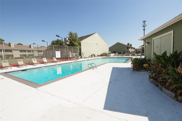 view of swimming pool with a patio