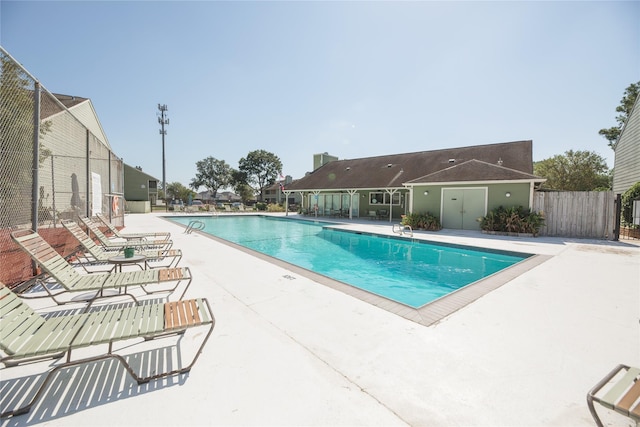 view of swimming pool with a patio