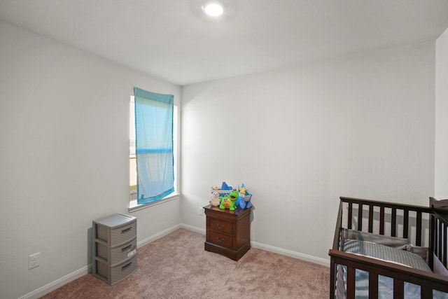 bedroom with light carpet