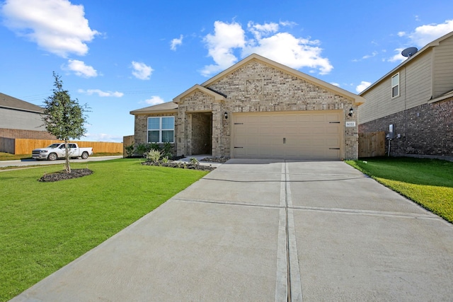 view of front of house with a garage and a front yard