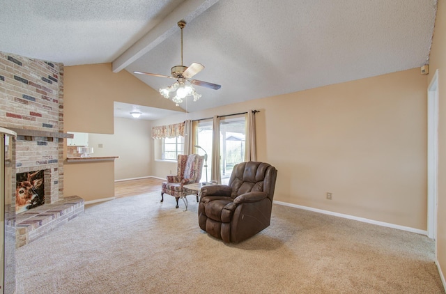 living area featuring light carpet, a textured ceiling, lofted ceiling with beams, and ceiling fan