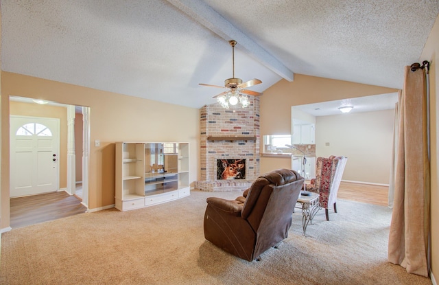 living room featuring vaulted ceiling with beams, ceiling fan, light colored carpet, and a textured ceiling