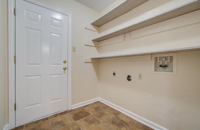 laundry area with electric dryer hookup, washer hookup, and a textured ceiling