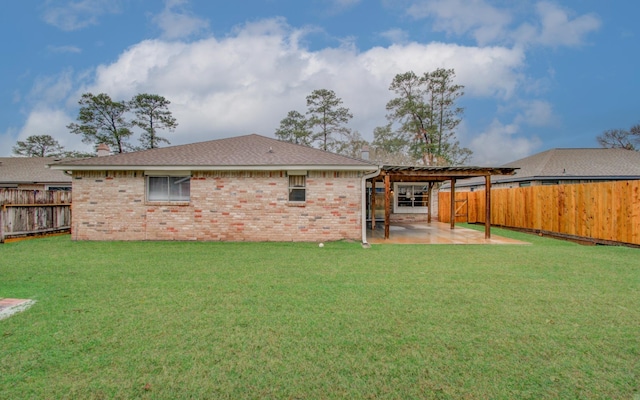 rear view of property with a patio area and a lawn