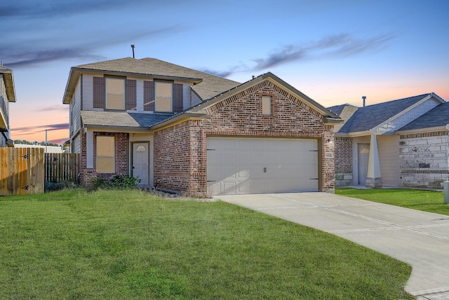 view of front property with a lawn and a garage