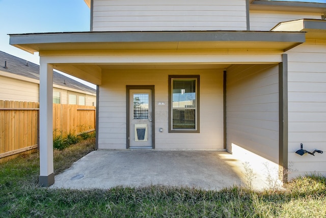 entrance to property with a patio