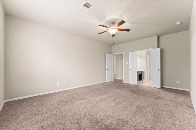 unfurnished bedroom featuring carpet and ceiling fan