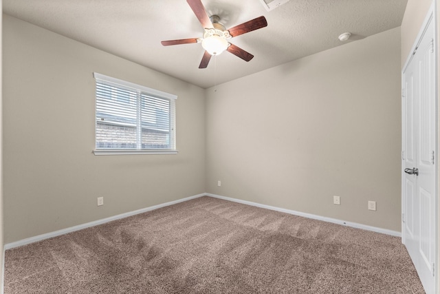 empty room with carpet flooring and ceiling fan