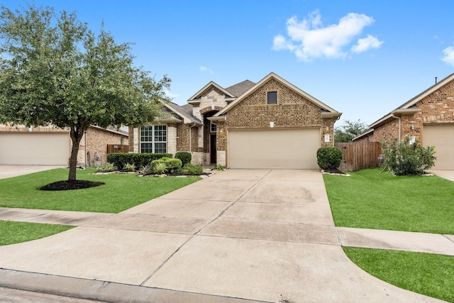 view of front of property featuring a garage and a front lawn