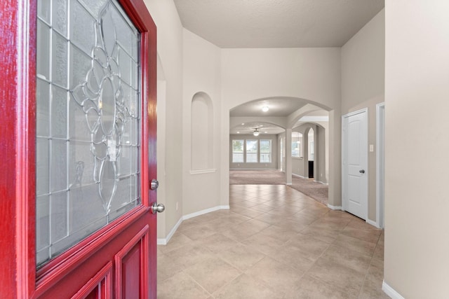 entrance foyer featuring ceiling fan