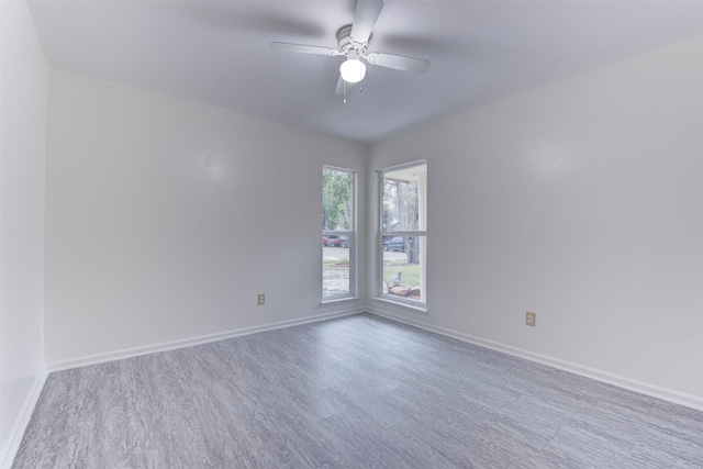 unfurnished room featuring light hardwood / wood-style floors and ceiling fan