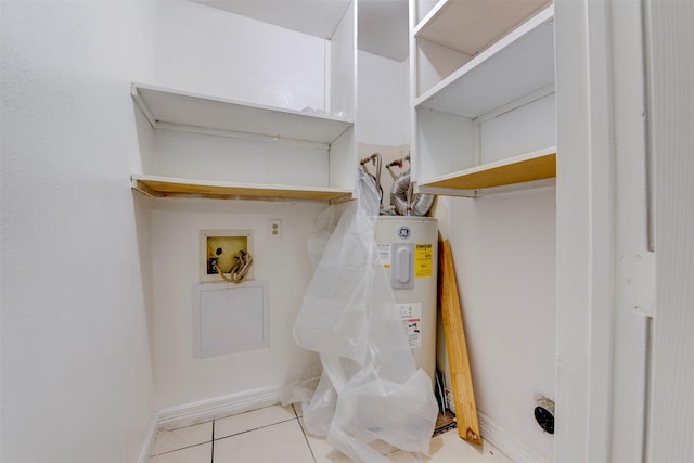 laundry room with washer hookup and light tile patterned floors