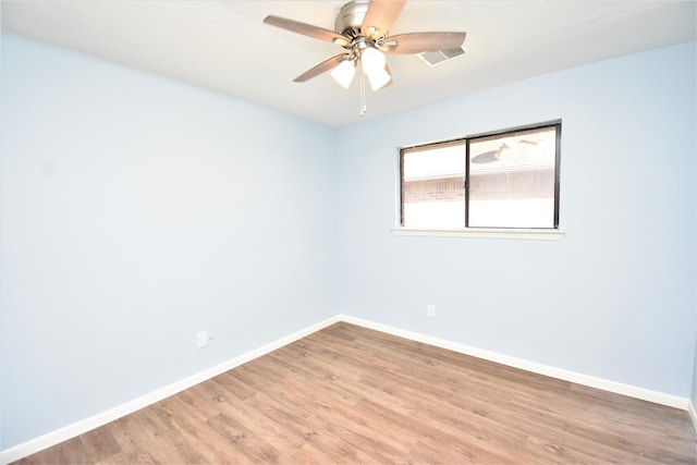 unfurnished room with light wood-type flooring and ceiling fan