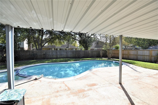 view of swimming pool featuring a patio area