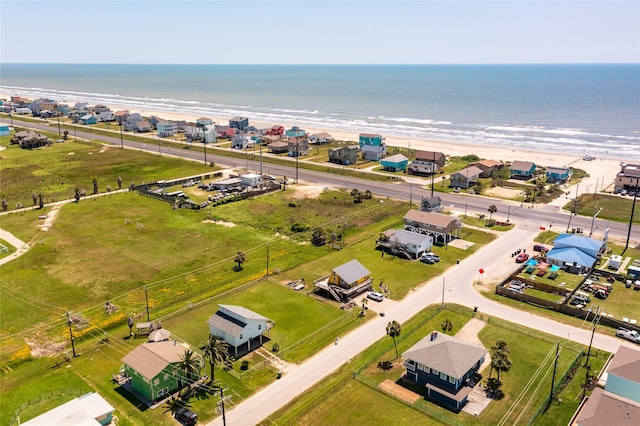 aerial view featuring a view of the beach and a water view