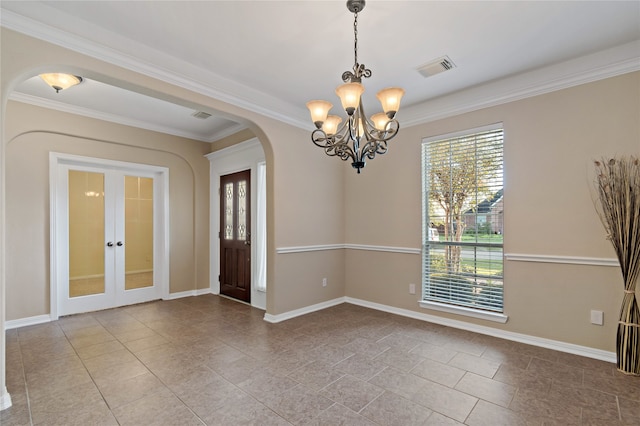 unfurnished room featuring crown molding, light tile patterned flooring, and an inviting chandelier