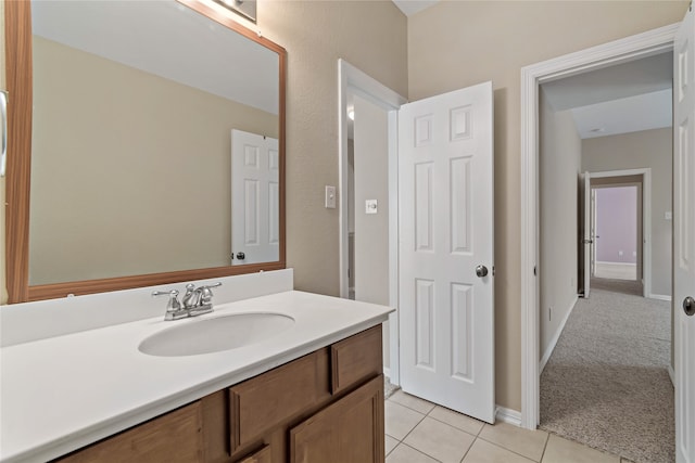 bathroom featuring tile patterned flooring and vanity