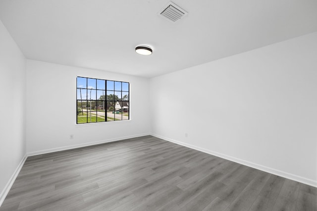 unfurnished room featuring wood-type flooring