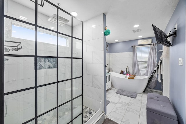 bathroom with plus walk in shower and tile walls