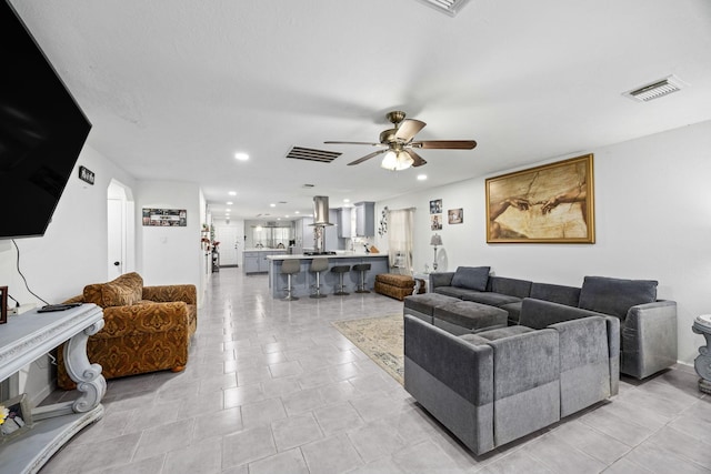 living room with ceiling fan