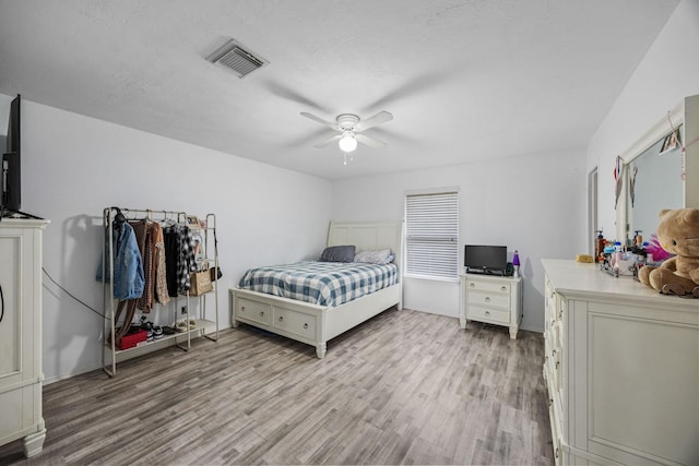 bedroom featuring ceiling fan and light wood-type flooring