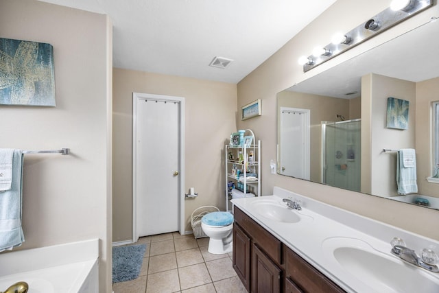 full bathroom featuring tile patterned flooring, vanity, separate shower and tub, and toilet