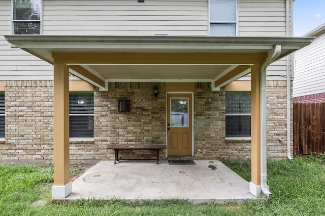 entrance to property with a patio