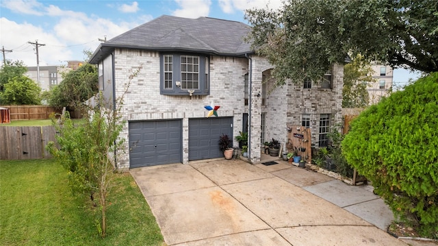 view of front of home featuring a garage and a front lawn