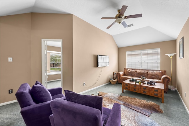 carpeted living room featuring ceiling fan and vaulted ceiling