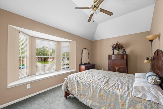 carpeted bedroom with ceiling fan and lofted ceiling