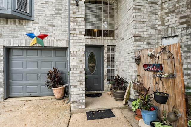 view of exterior entry with a garage