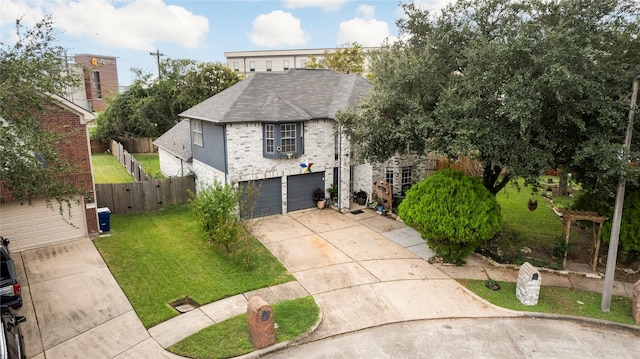 view of front of house featuring a front yard and a garage