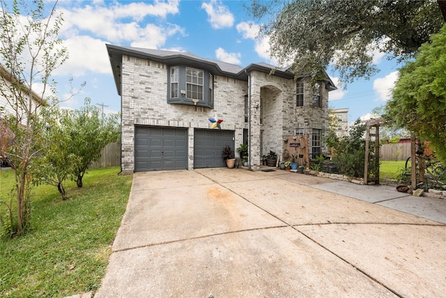 view of front of home featuring a front lawn and a garage