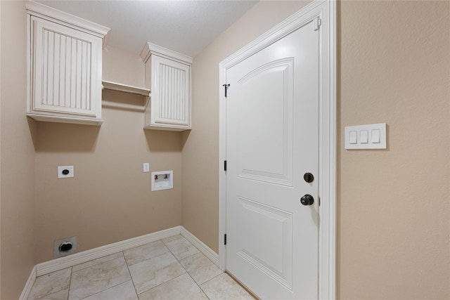 laundry area featuring hookup for an electric dryer, washer hookup, cabinets, and light tile patterned flooring