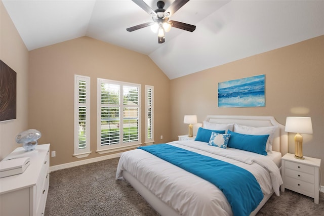 bedroom featuring dark colored carpet, vaulted ceiling, and ceiling fan