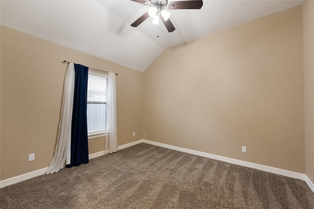 carpeted spare room with ceiling fan and lofted ceiling