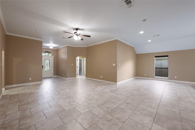 empty room featuring ceiling fan, ornamental molding, and lofted ceiling