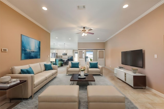 tiled living room featuring crown molding and ceiling fan