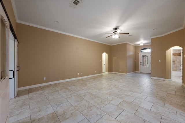 unfurnished room featuring ceiling fan and crown molding