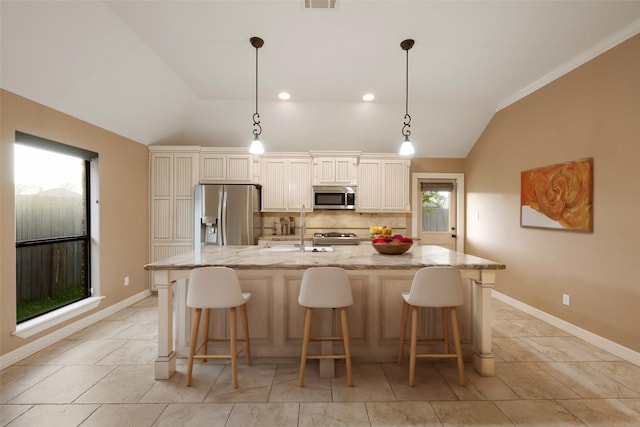 kitchen with pendant lighting, lofted ceiling, backsplash, a spacious island, and stainless steel appliances