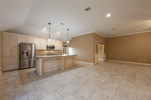 kitchen featuring appliances with stainless steel finishes, light stone counters, a kitchen island with sink, decorative light fixtures, and lofted ceiling