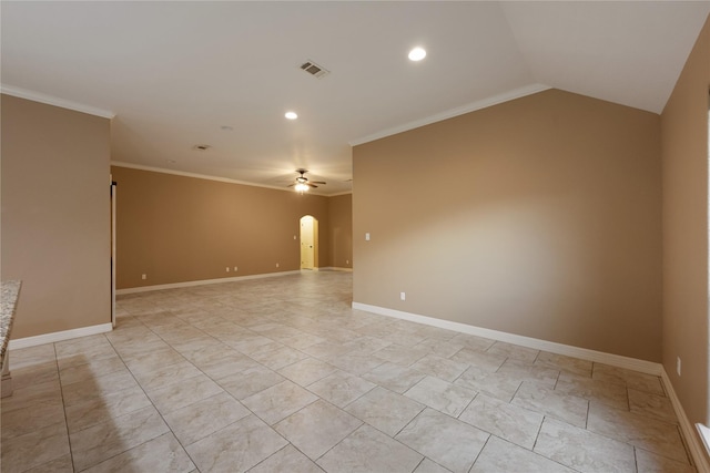 empty room with vaulted ceiling, ceiling fan, and ornamental molding