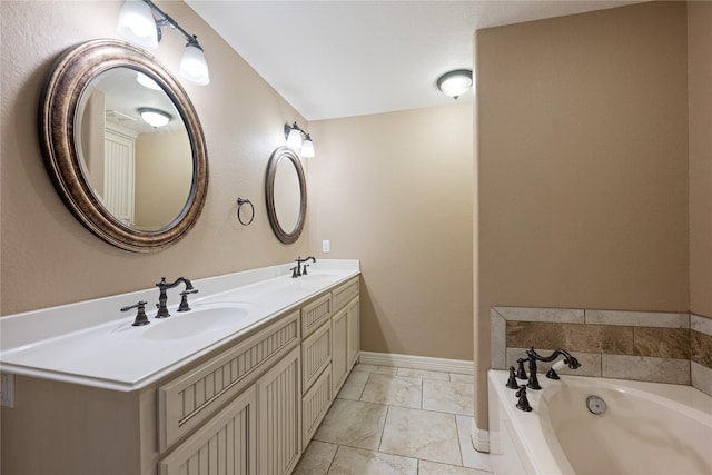 bathroom featuring tile patterned floors, a bathtub, and vanity