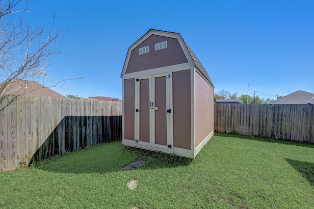 view of outdoor structure featuring a lawn