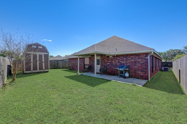 view of yard with a storage unit and a patio area