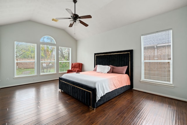 bedroom with ceiling fan, dark hardwood / wood-style floors, and lofted ceiling